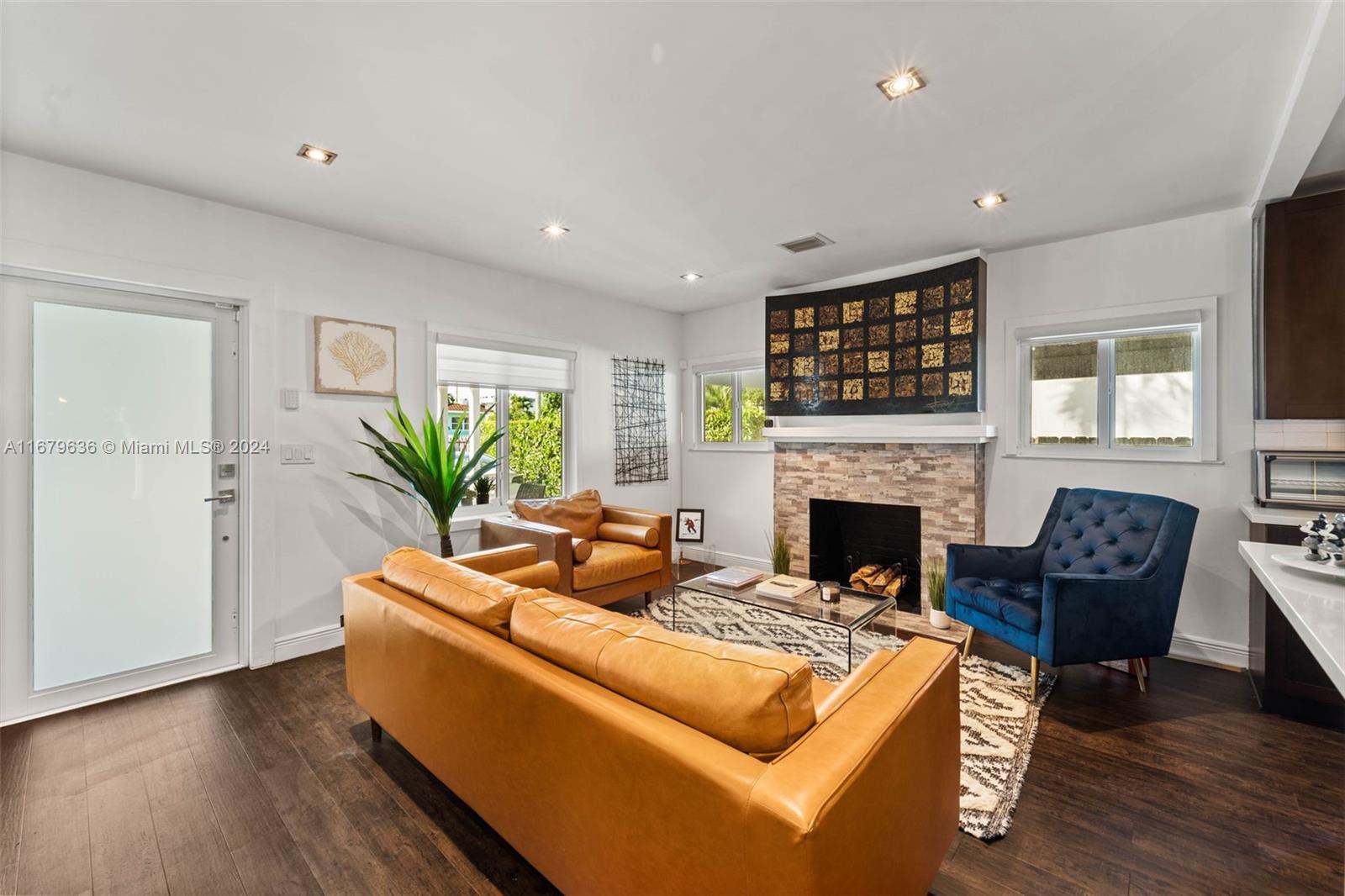 1757 Southwest 24th Terrace Miami, FL 33145 - Photo 3 of 26 a living room with furniture a fireplace and a potted plant