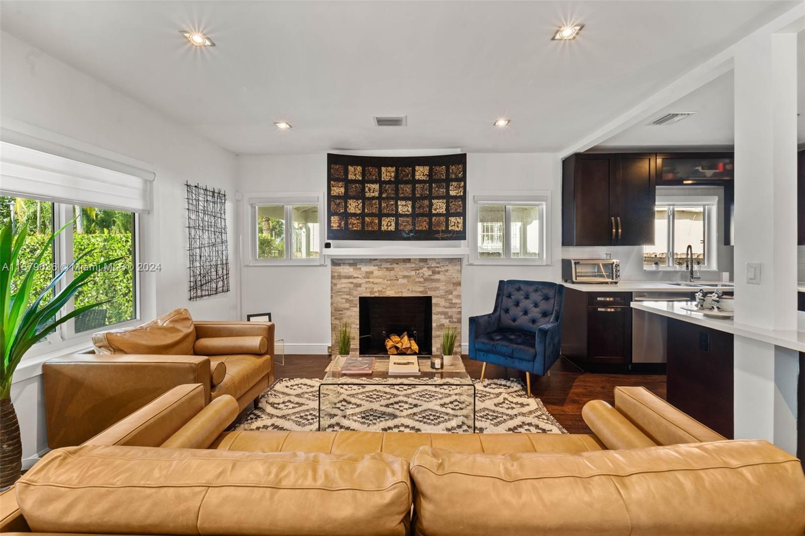 1757 Southwest 24th Terrace Miami, FL 33145 - Photo 4 of 26 a living room with furniture fireplace and flat screen tv