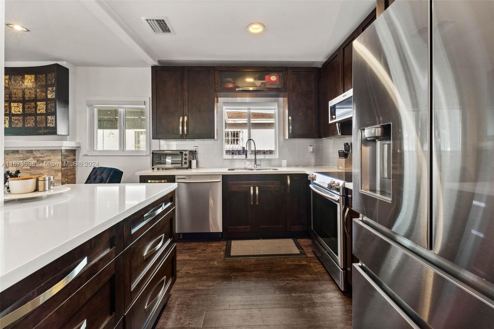 1757 Southwest 24th Terrace Miami, FL 33145 - Photo 7 of 26 a kitchen with a sink stove and refrigerator