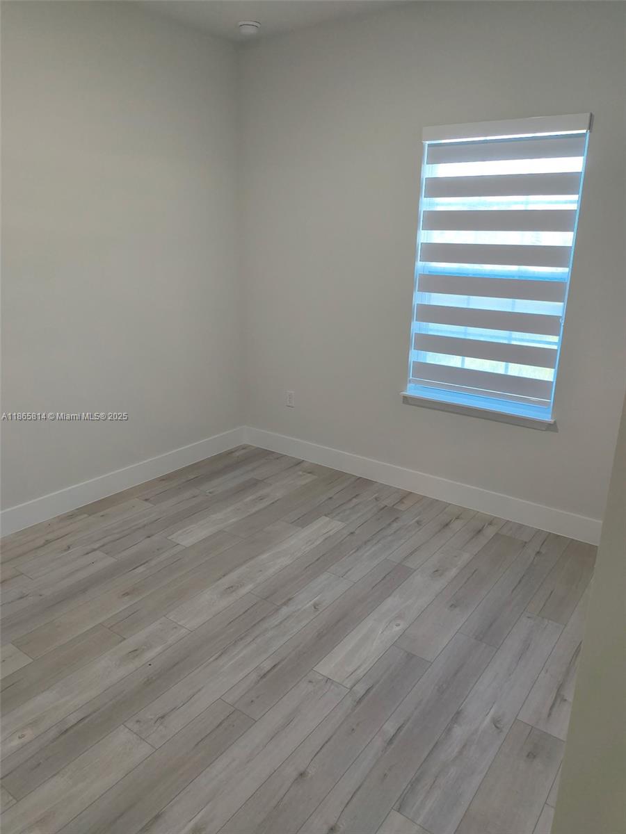 16745 Southwest 29th Terrace Ocala, FL 34473 - Photo 15 of 21 a view of a room that has wooden floor and a window in it