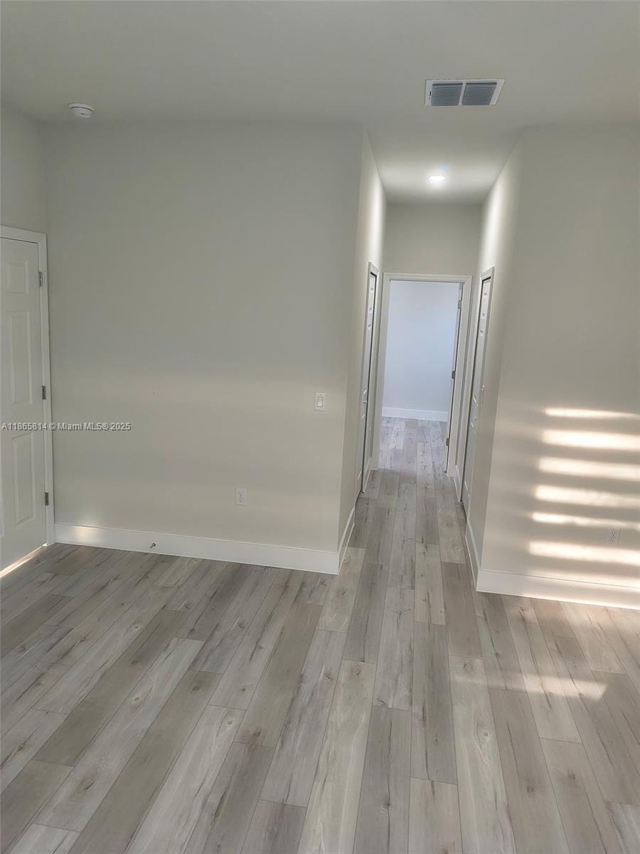 16745 Southwest 29th Terrace Ocala, FL 34473 - Photo 5 of 21 a view of a room with wooden floor