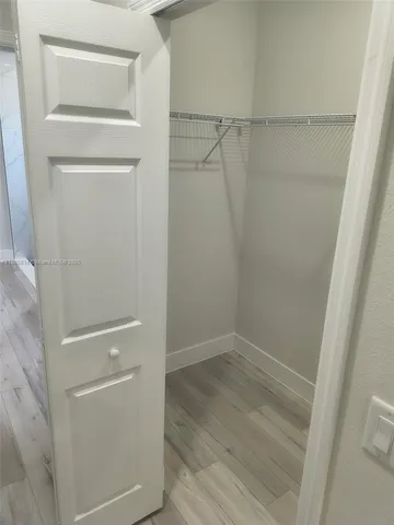 a view of an empty walk in closet
