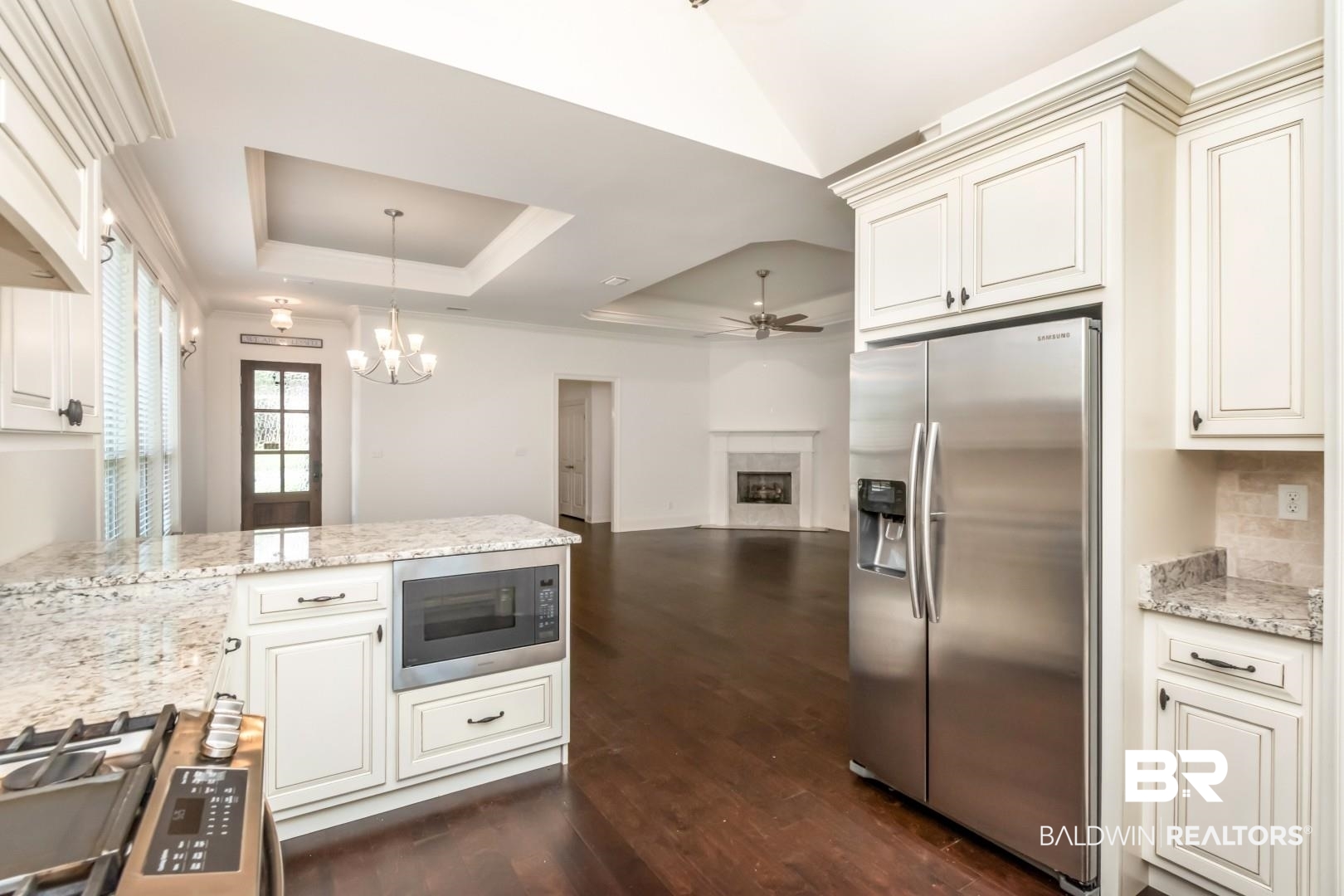 3528 Rue Royal Mobile, AL 36693 - Photo 13 of 53 Kitchen featuring light-toned cabinetry, granite countertops, and stainless steel appliances