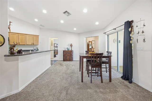 a kitchen with stainless steel appliances granite countertop sink stove and refrigerator