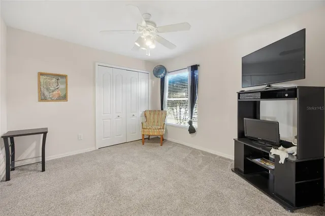 a view of a livingroom with furniture and a flat screen tv