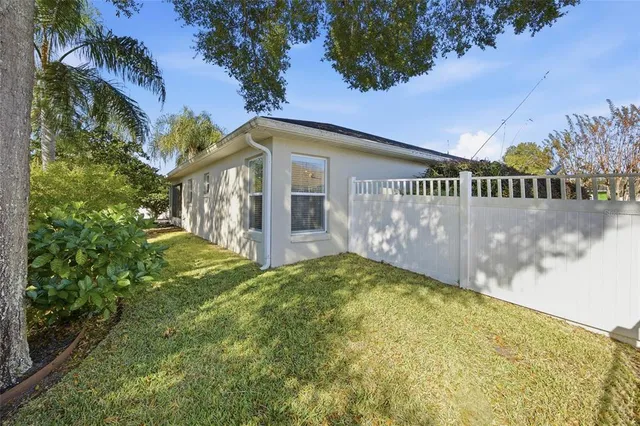 an aerial view of multiple houses with yard