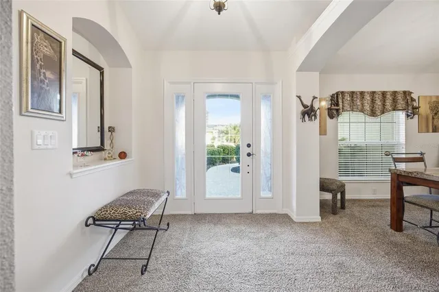 a view of room with furniture and a window