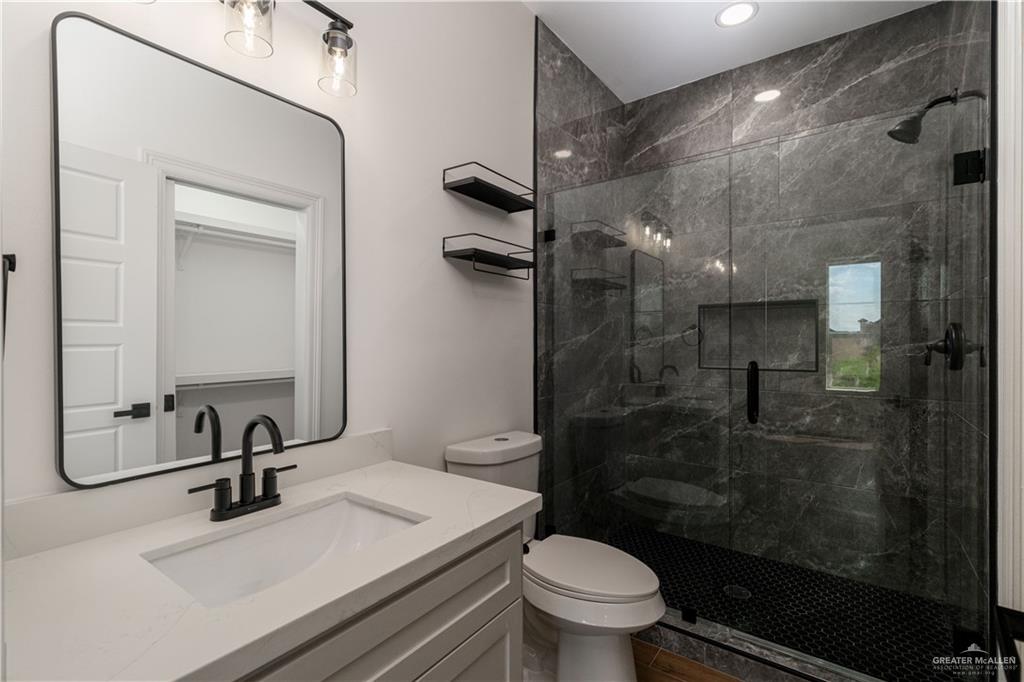 5508 North Crown Point Pharr, TX 78577 - Photo 12 of 17 a bathroom with a sink a toilet and shower