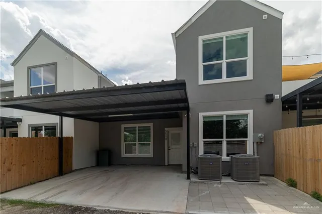 a front view of a house with a large window