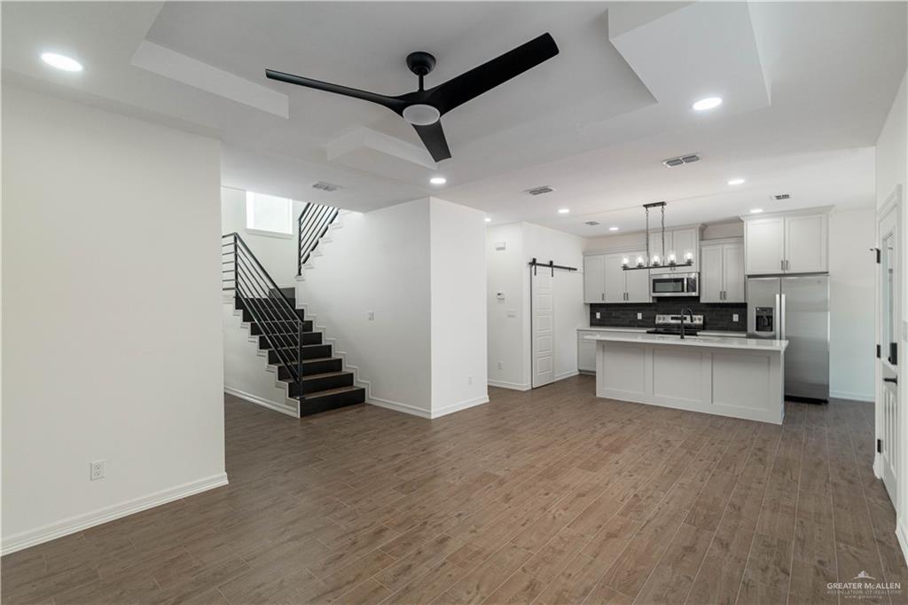 5508 North Crown Point Pharr, TX 78577 - Photo 2 of 17 a view of kitchen with refrigerator and white cabinets