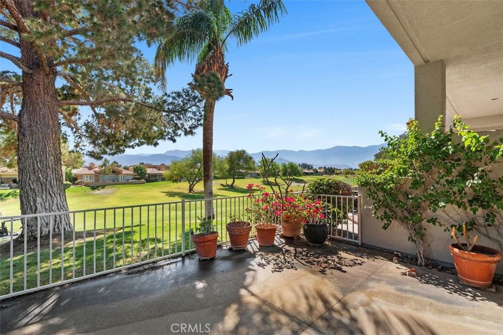 51 Pebble Beach Drive Rancho Mirage, CA 92270 - Photo 3 of 10 a view of a lake with a patio