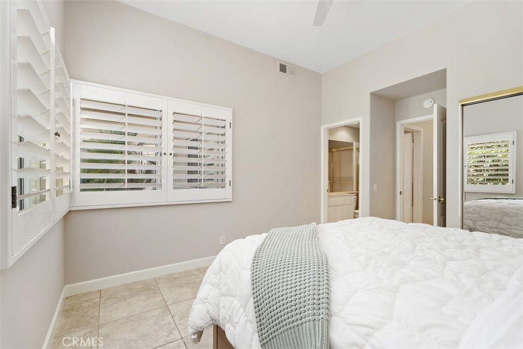 51 Pebble Beach Drive Rancho Mirage, CA 92270 - Photo 7 of 10 a bedroom with a bed and a window