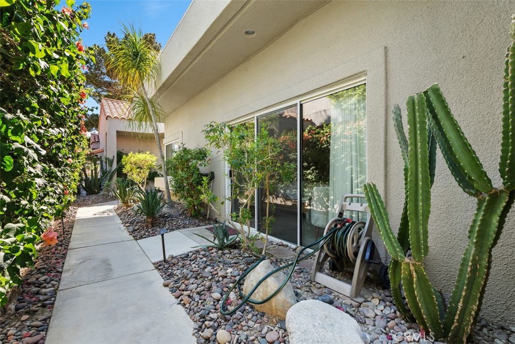 51 Pebble Beach Drive Rancho Mirage, CA 92270 - Photo 8 of 10 a house view with a garden space