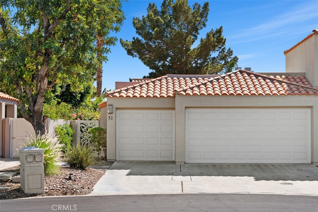 51 Pebble Beach Drive Rancho Mirage, CA 92270 - Photo 9 of 10 a front view of a house