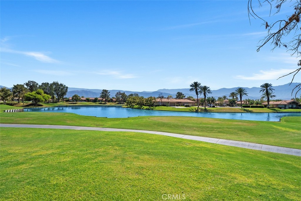 51 Pebble Beach Drive Rancho Mirage, CA 92270 - Photo 10 of 10 a view of a house with a big yard and potted plants