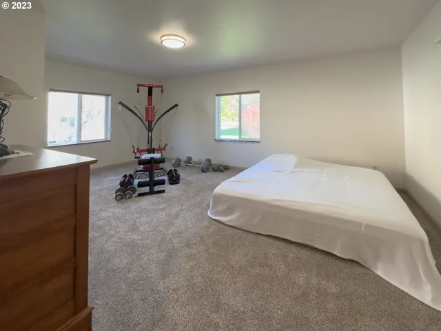 a bedroom with a bed furniture and a window