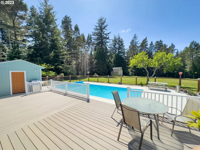 a view of a swimming pool with a lounge chair