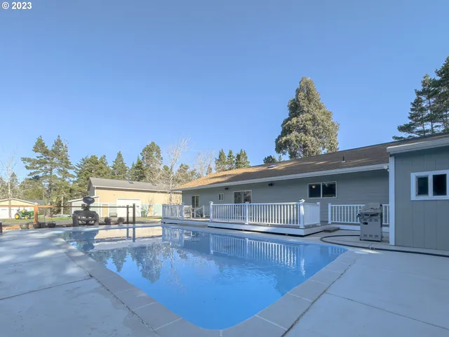 a view of a house with swimming pool