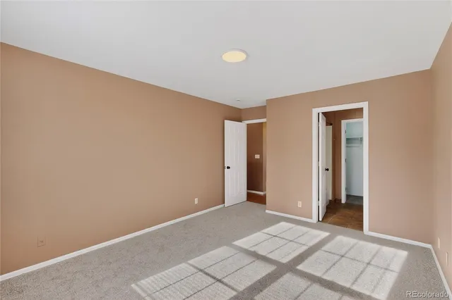 a view of an empty room and window