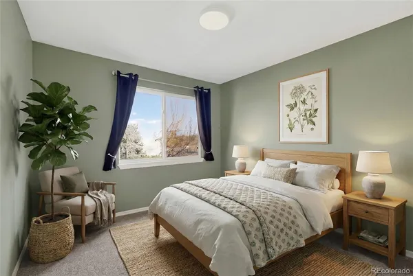 a bedroom with a large bed and a window