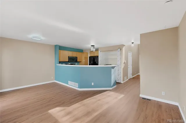 a kitchen with a sink stove and refrigerator