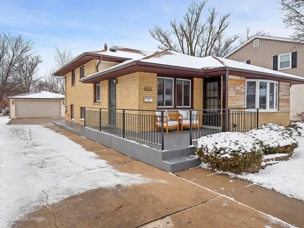 a front view of a house with patio