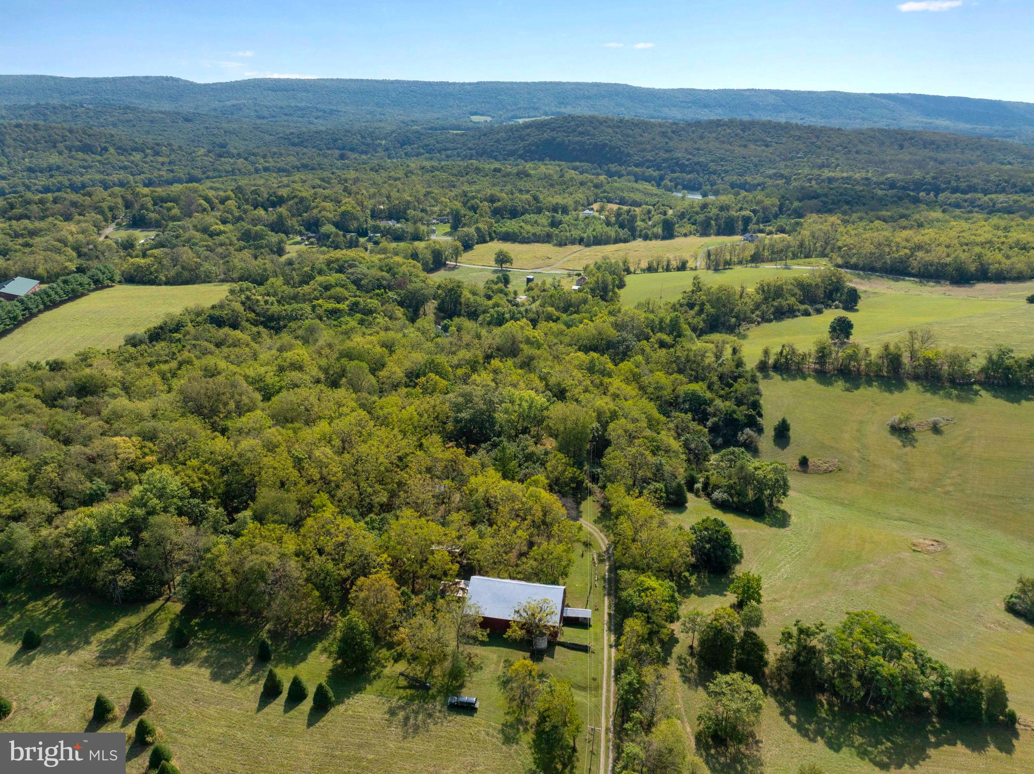 364 Knott Road Shepherdstown, WV 25443 - Photo 16 of 66 an aerial view of a houses with a lake view