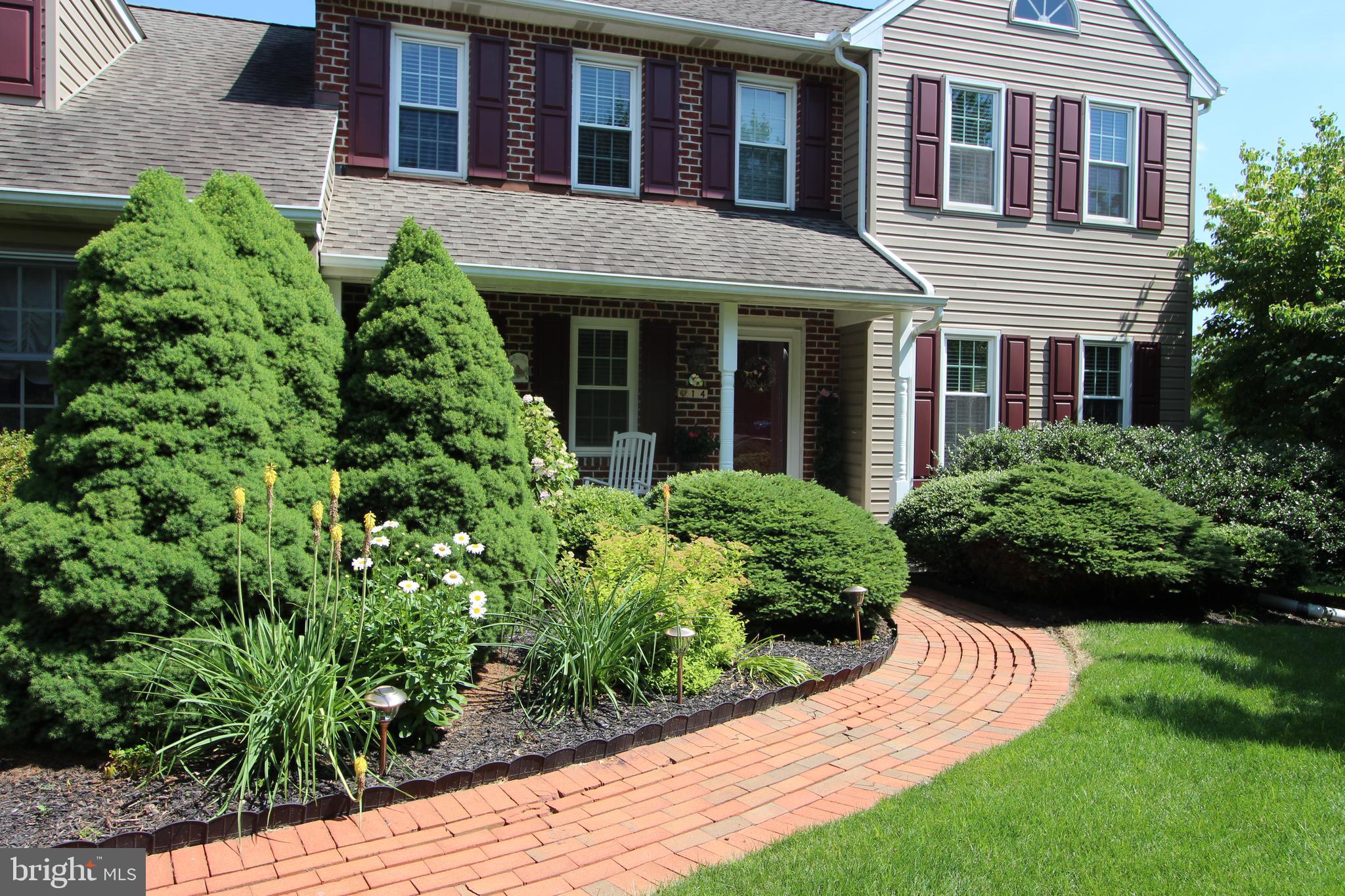 14 Countryside Lane Lititz, PA 17543 - Photo 3 of 41 a view of a brick house with a yard and plants
