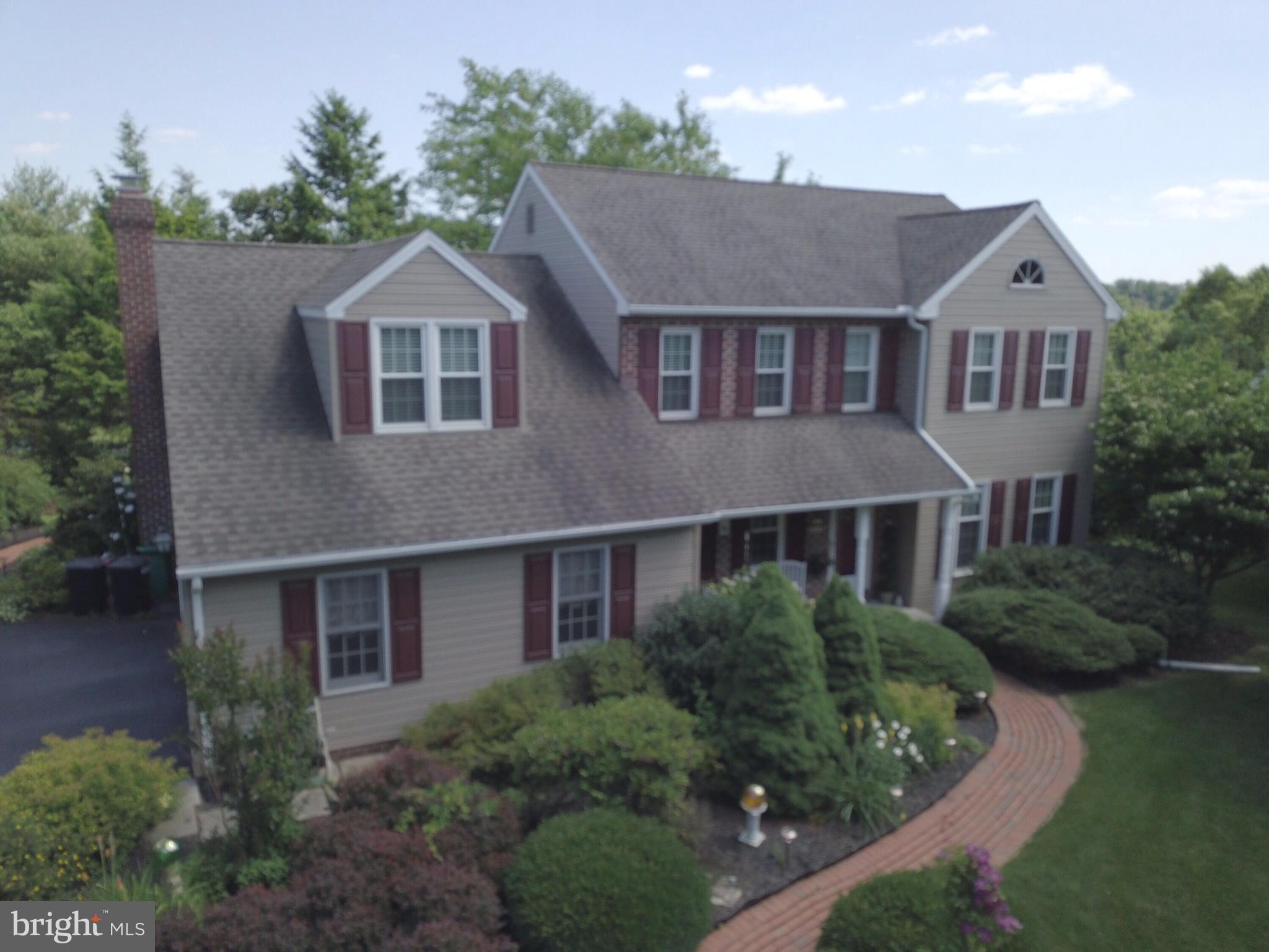 14 Countryside Lane Lititz, PA 17543 - Photo 4 of 41 a front view of a house with a yard and garage