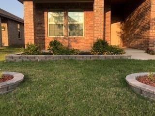 604 Rustic Meadows Trail Princeton, TX 75407 - Photo 14 of 15 a front view of a house with garden