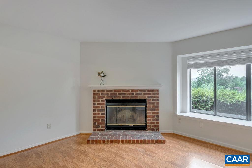 23 Ridgeview Circle Charlottesville, VA 22902 - Photo 7 of 27 a living room with a fireplace and a floor