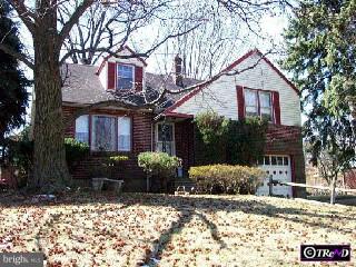 408 Salisbury Road Wyncote, PA 19095 - Photo 1 of 1 a front view of a house with a yard