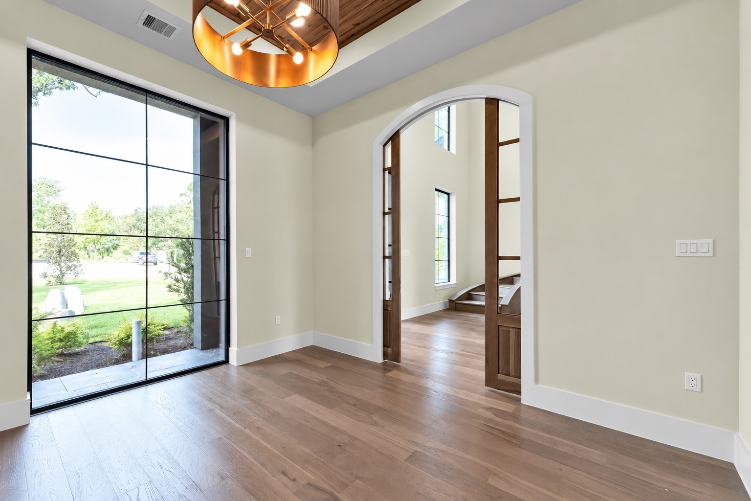 23701 Birch Grove Road Montgomery, TX 77316 - Photo 6 of 50 Elegant study just off the entrance, featuring a stunning front garden view through expansive windows.