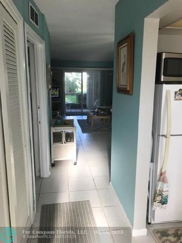 a view of a kitchen from the hallway