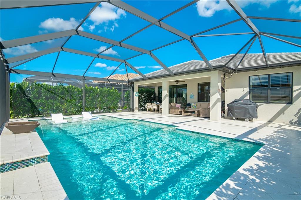 19826 Bittersweet Lane Estero, FL 33928 - Photo 25 of 50 a view of a house with backyard porch and sitting area