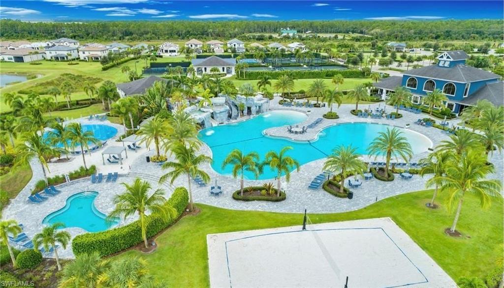 19826 Bittersweet Lane Estero, FL 33928 - Photo 34 of 50 a view of a swimming pool with lawn chairs and plants