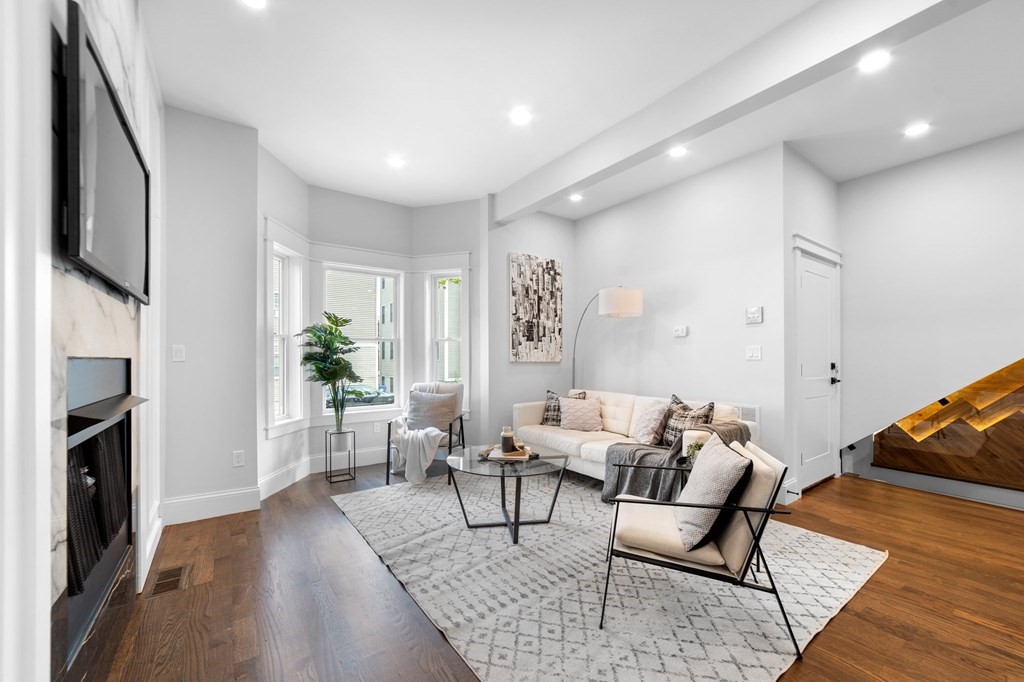 615 East 3rd Street, Unit 1 Boston, MA 02127 - Photo 11 of 42 a living room with furniture and a fireplace