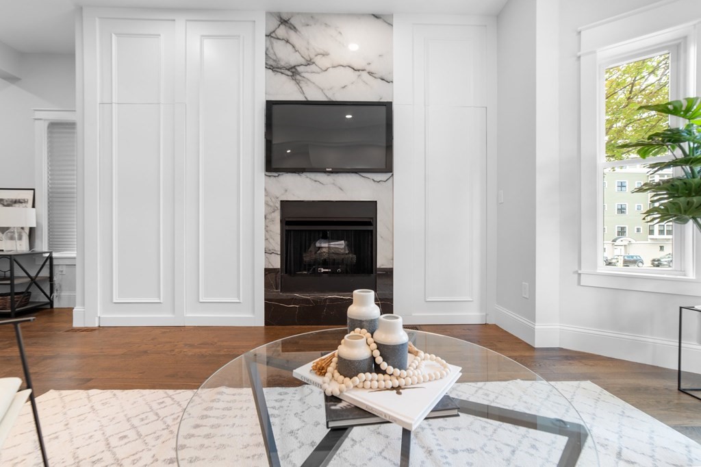 615 East 3rd Street, Unit 1 Boston, MA 02127 - Photo 14 of 42 a living room with furniture and a fireplace