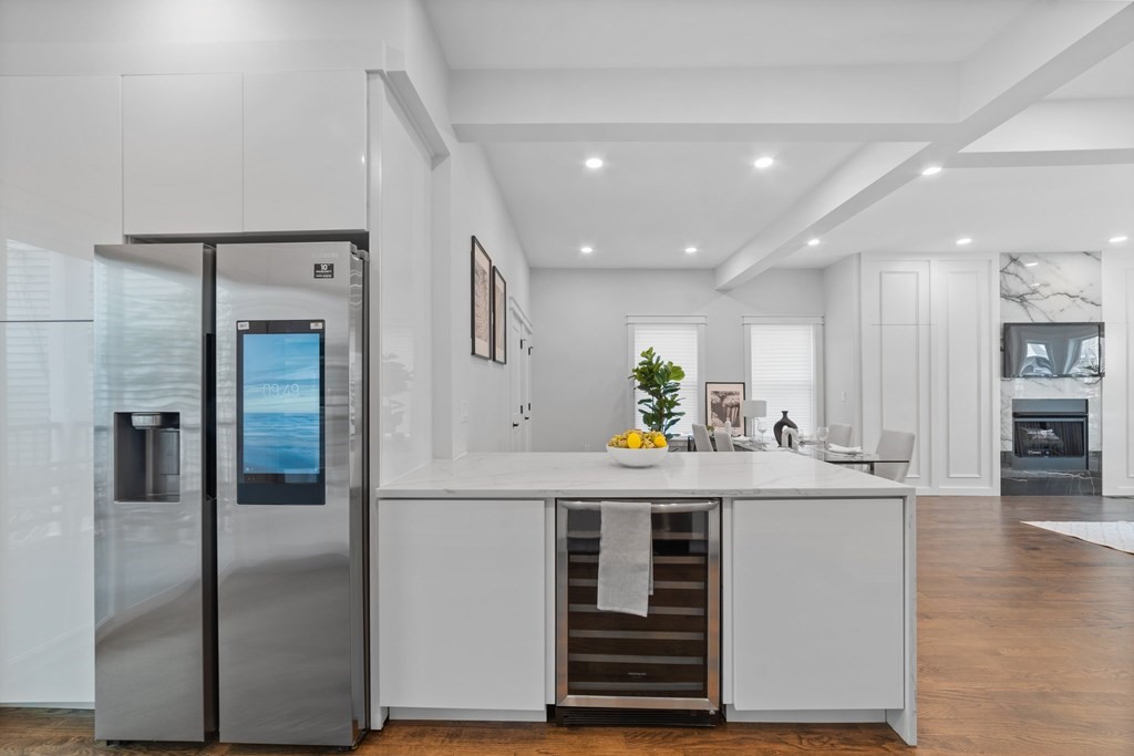 615 East 3rd Street, Unit 1 Boston, MA 02127 - Photo 22 of 42 a kitchen with kitchen island a sink appliances and cabinets