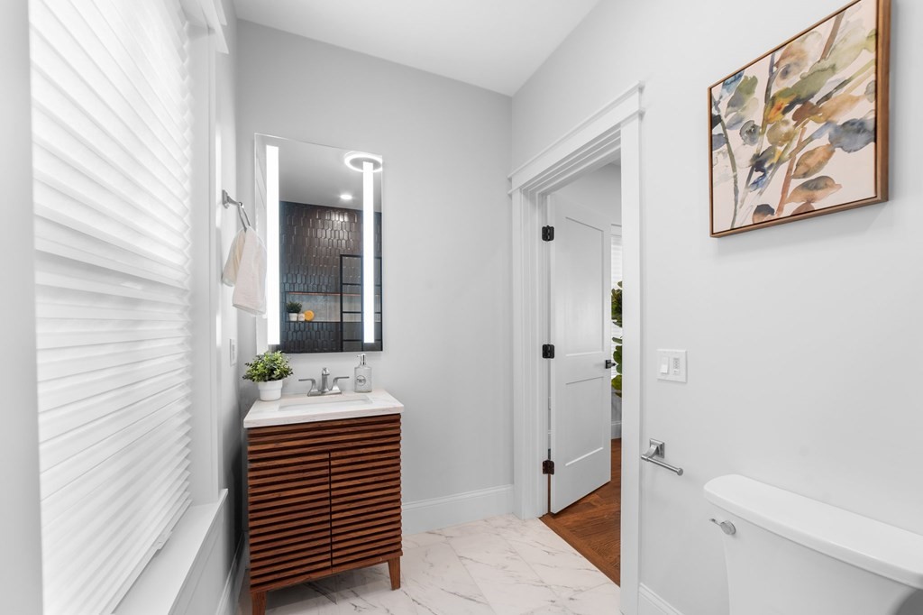 615 East 3rd Street, Unit 1 Boston, MA 02127 - Photo 25 of 42 a bathroom with a sink and a mirror