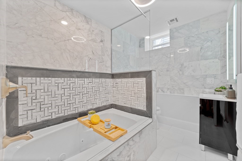 615 East 3rd Street, Unit 1 Boston, MA 02127 - Photo 31 of 42 a bathroom with a sink and a shower