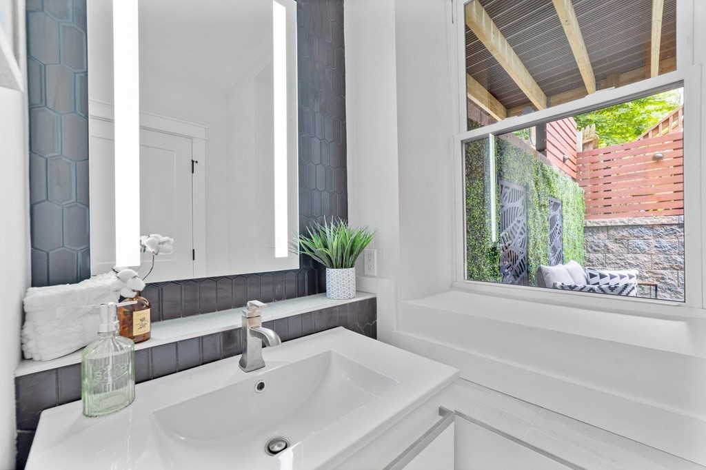 615 East 3rd Street, Unit 1 Boston, MA 02127 - Photo 40 of 42 a bathroom with a sink and a bathtub