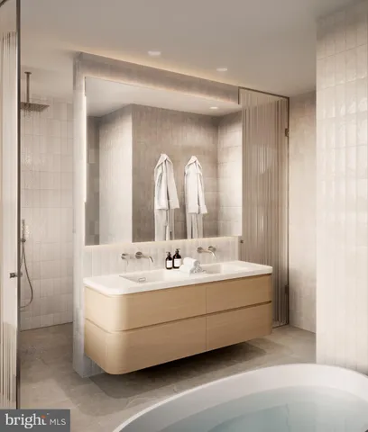 a bathroom with a sink a mirror and a bathtub