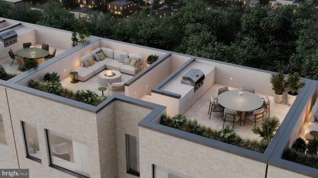 an aerial view of a house with backyard space and seating