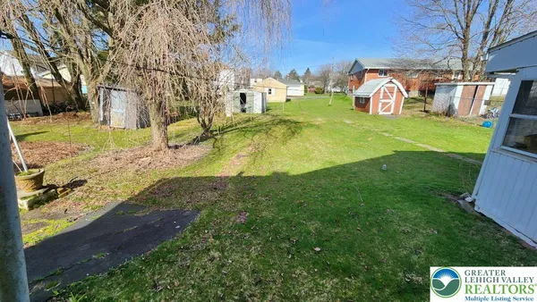 a view of yard with swimming pool