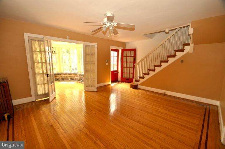 3616 Yolando Road Baltimore, MD 21218 - Photo 15 of 20 a view of an empty room with wooden floor and a window