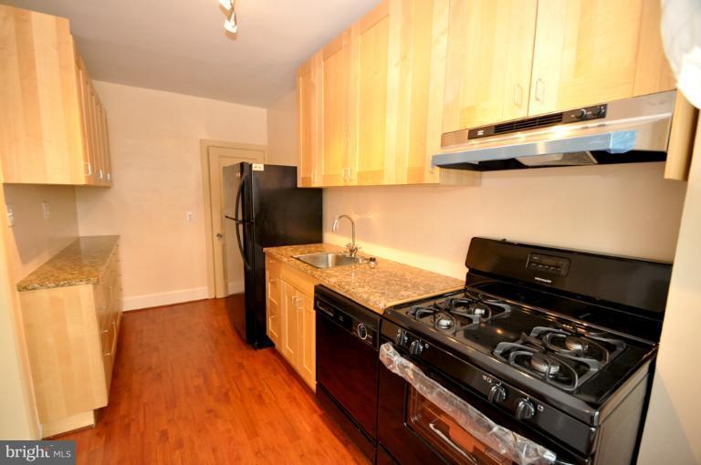 3616 Yolando Road Baltimore, MD 21218 - Photo 18 of 20 a kitchen with a stove and a refrigerator