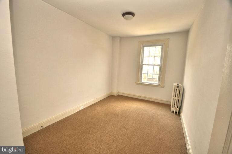 3616 Yolando Road Baltimore, MD 21218 - Photo 3 of 20 an empty room with windows