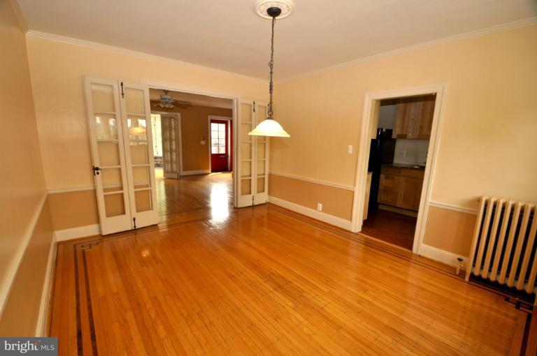 3616 Yolando Road Baltimore, MD 21218 - Photo 5 of 20 a view of a room with wooden floor and windows