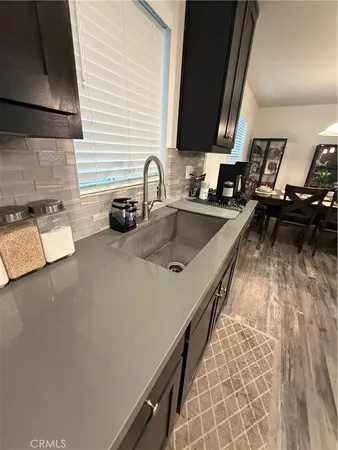 a kitchen with sink and stove